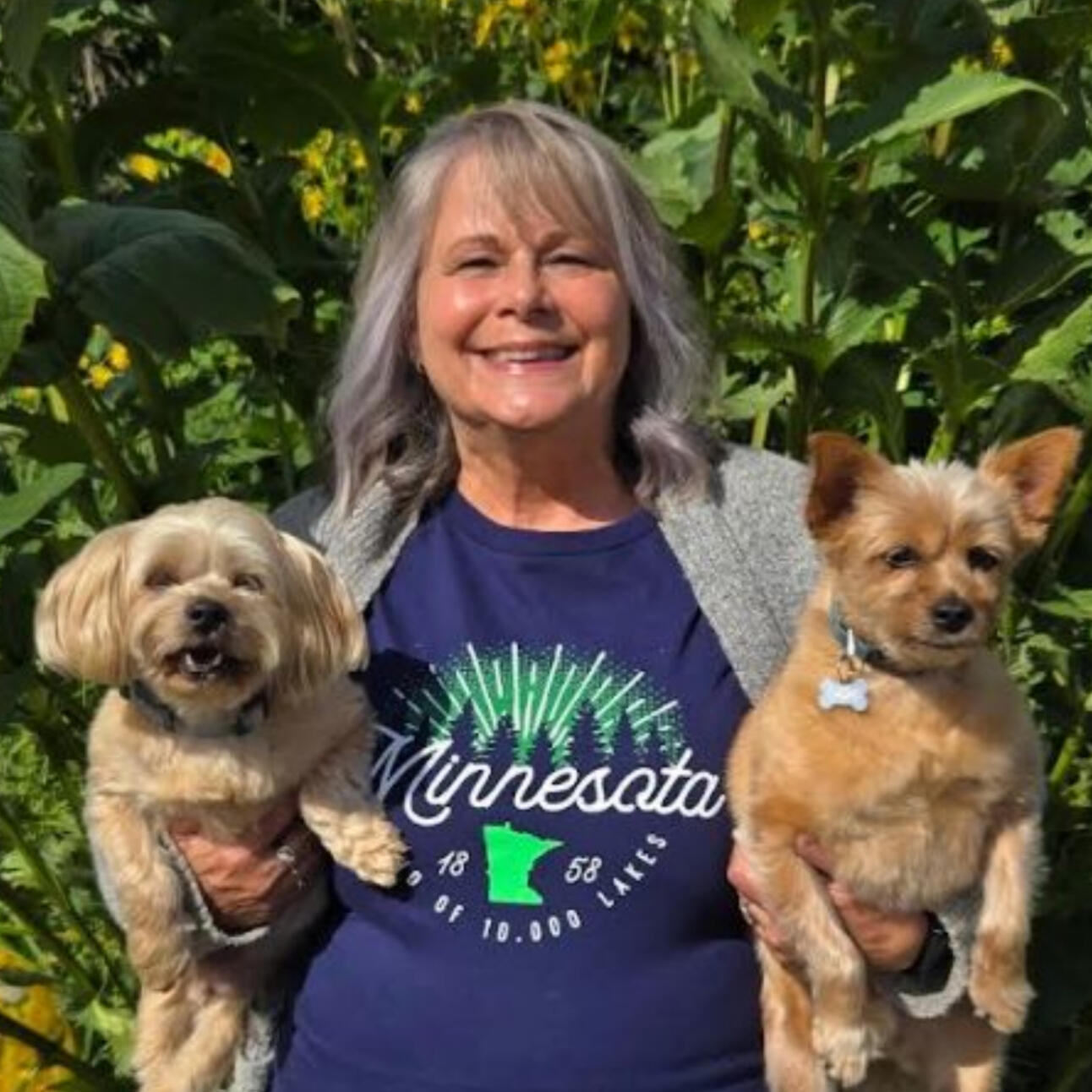 Candid photo of Kris and her two dogs.